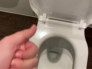 Wanking off in a public cubicle with big cumshot at the end 